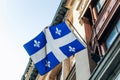 Quebec flag on a historic building facade in downtown Montreal, Quebec Royalty Free Stock Photo