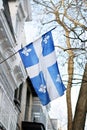 Quebec flag in Montreal billowing in the breeze Royalty Free Stock Photo