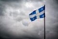 Quebec Flags Waves Before Stormy, Cloudy Skies Royalty Free Stock Photo