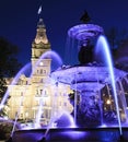 The Quebec Parliament Building and the Fontaine de Tourny illuminated at dusk in Quebec City