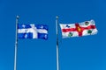 Quebec province flag and new Montreal city flag Royalty Free Stock Photo