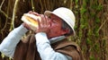 Quechua man is playing using sea shell