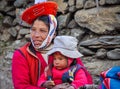 Quechua woman and baby in a village in the Andes, Ollantaytambo, Peru