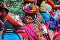 Quechua woman in colorful hat in a village in the Andes, Ollantaytambo, Peru