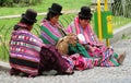 Quechua woman in traditional cloth and hats