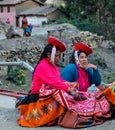 Quechua women in colorful dress in a village in the Andes, Ollantaytambo, Peru