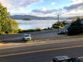 A beautiful seascape view of the town of Queen Charlotte with the coast and calm ocean waters in the background, in Haida Gwaii