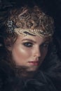 Queen of darkness in black fantasy costume on dark gothic background. High fashion beauty model with dark makeup. Royalty Free Stock Photo