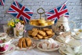 Queen Elizabeth II Platinum Jubilee cream tea street party food red white and blue flags  with celebration Union jack food toppers Royalty Free Stock Photo