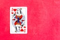 Queen of Hearts playing card, red background. Copy space Royalty Free Stock Photo