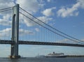 Queen Mary 2 cruise ship in New York Harbor under Verrazano Bridge heading for Transatlantic Crossing from New York to Southampton Royalty Free Stock Photo