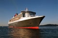 RMS Queen Mary 2 at sea at sunrise