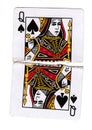 A queen of spades playing card torn in half.