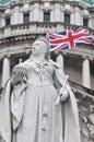 Queen Victoria Statue with Union Flag Behind Royalty Free Stock Photo