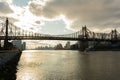 Queensboro Bridge over the East River in New York City with the Shining Sun and Clouds Royalty Free Stock Photo