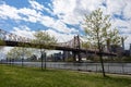 Queensbridge Park along the East River with the Queensboro Bridge and Green Trees during Spring in Long Island City Queens New Yor Royalty Free Stock Photo