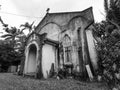 Queensland, Australia, 10/04/2013, Old spooky abandoned rustic church, hidden away in a tropical forest, shot in black and white.