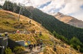 Queenstown, New Zealand -September-25-2017 : Tourist riding cable car lift to get to Luge entrance on skyline Queenstown. Royalty Free Stock Photo