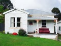 View of the front of an old white weatherboard house Royalty Free Stock Photo