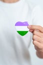 Queer Pride Day and LGBT pride month concept. purple, white and green heart shape for Lesbian, Gay, Bisexual, Transgender,