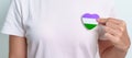 Queer Pride Day and LGBT pride month concept. purple, white and green heart shape for Lesbian, Gay, Bisexual, Transgender,