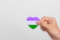 Queer Pride Day and LGBT pride month concept. purple, white and green heart shape for Lesbian, Gay, Bisexual, Transgender,