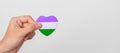 Queer Pride Day and LGBT pride month concept. purple, white and green heart shape for Lesbian, Gay, Bisexual, Transgender,