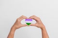 Queer Pride Day and LGBT pride month concept. purple, white and green heart shape for Lesbian, Gay, Bisexual, Transgender,