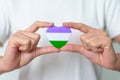 Queer Pride Day and LGBT pride month concept. purple, white and green heart shape for Lesbian, Gay, Bisexual, Transgender,