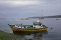 QUELLON, CHILE. Colourful fishing boats in the coastal town of Quellon on the island of Chiloe in Chile