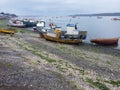 QUELLON, CHILE. Colourful fishing boats in the coastal town of Quellon on the island of Chiloe in Chile