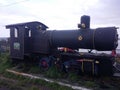 QUELLON. Old steam engine in a coastal garden in Quellon, a fishing town on the Island of Chiloe in southern Chile