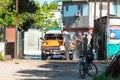 A cuban man washing an american brown 1955 Desoto classic car with white roof in a Royalty Free Stock Photo