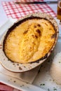 Quenelle, speciality of Lyon, oval-shaped dumplings filled with pike white fish served in creamy sauce in traditional Lyonnaise