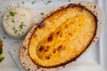 Quenelle, speciality of Lyon, oval-shaped dumplings filled with pike white fish served in creamy sauce in traditional Lyonnaise