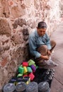Mexican man selling handcrafts and other objects