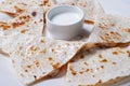 Quesadilla with beef and chicken on a white plate. quesadilla and sauce. Royalty Free Stock Photo