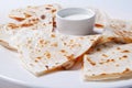 Quesadilla with beef and chicken on a white plate. quesadilla and sauce. Royalty Free Stock Photo