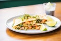 quesadilla with grilled shrimp, lime wedge aside Royalty Free Stock Photo