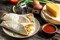 Quesadilla with scramble eggs, vegetables, ham and cheese. Mexican cuisine, Mexico and Latin America traditional restaurant menu Royalty Free Stock Photo