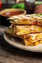 Quesadilla Traditional Mexican tortillas with scramble eggs, vegetables, ham and cheese. vertical image Royalty Free Stock Photo