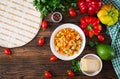 Quesadilla wrap with chicken, corn and sweet pepper and tomato sauce. Royalty Free Stock Photo