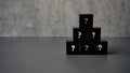 Question and answer concept. Stack of black cube with a symbol of question mark Royalty Free Stock Photo