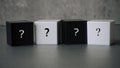 Question and answer concept. Stack of black and white cube with a symbol of question mark Royalty Free Stock Photo