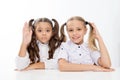 Question and answer. little school girls know answer to question. i know. little school girls with raised hands. Royalty Free Stock Photo