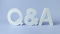 Question and Answer Session Concept: White Q&A Letters on a Clean Blue Background Royalty Free Stock Photo