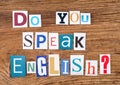 Question `Do you speak English?` on wooden background