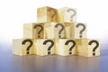 question icon on wooden box light gray background,Abstract image of doubt and ignorance Royalty Free Stock Photo