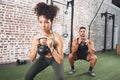 The question isnt can you, its will you. two sporty young people using kettlebells while working out at the gym. Royalty Free Stock Photo