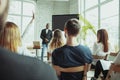 Male african-american speaker giving presentation in hall at university workshop